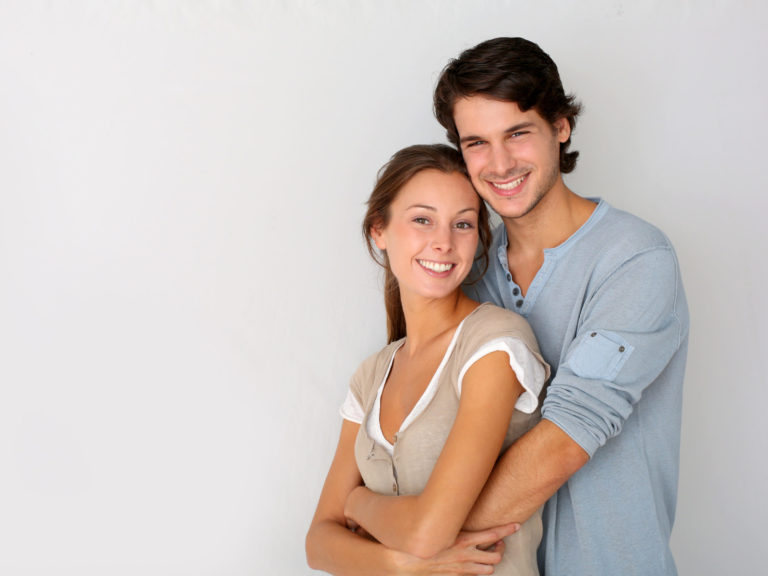 Cheerful,Young,Couple,Standing,On,White,Background,,Isolated